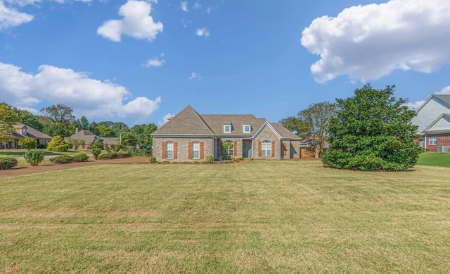 view of front of home with a front yard