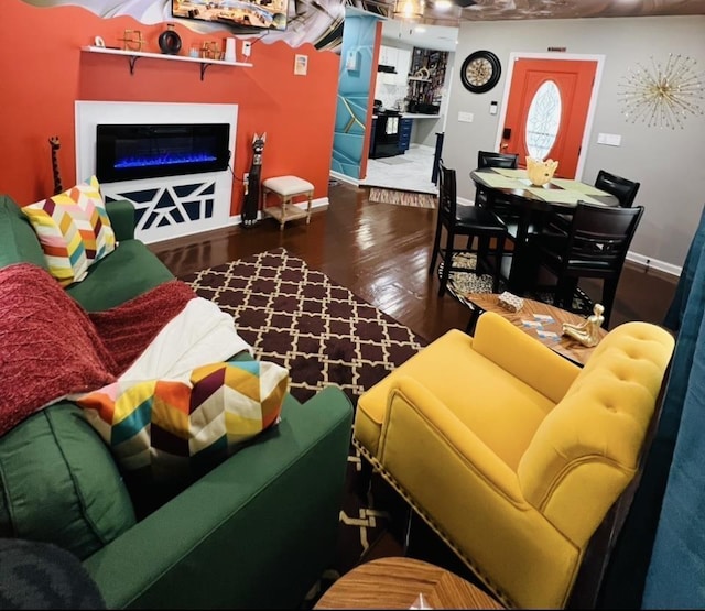 living room with dark hardwood / wood-style flooring