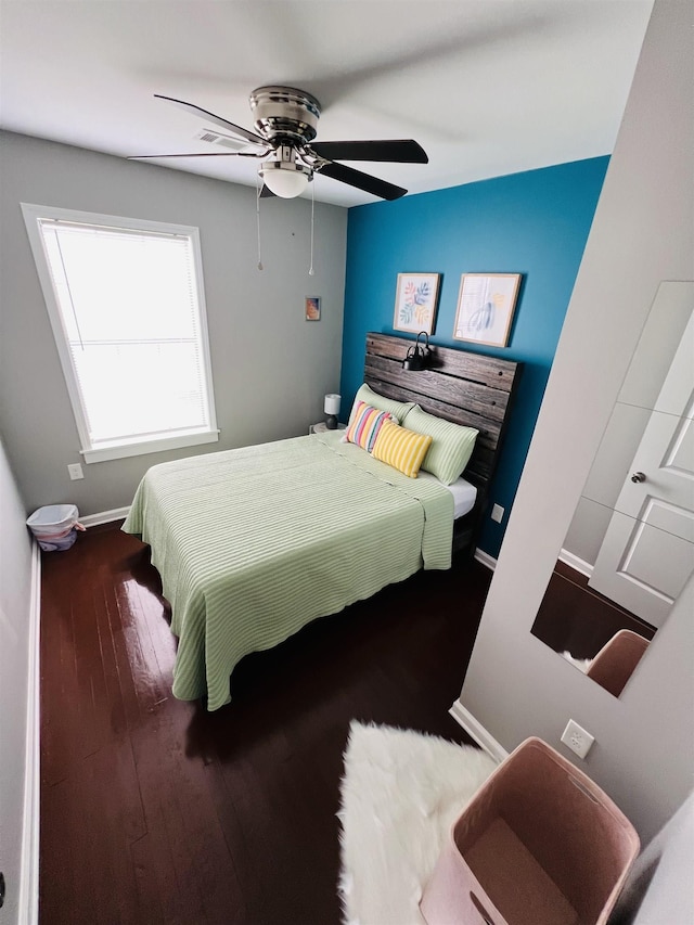 bedroom with wood-type flooring and ceiling fan