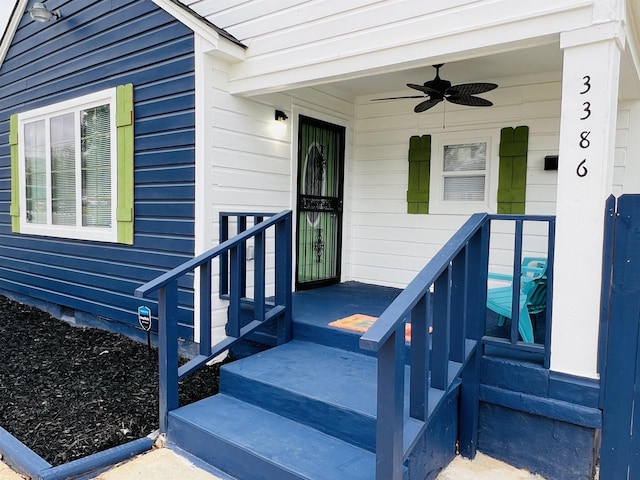 view of exterior entry featuring ceiling fan