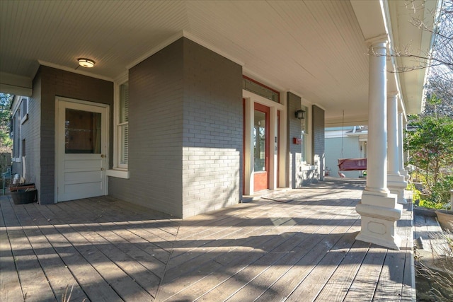 wooden deck featuring covered porch