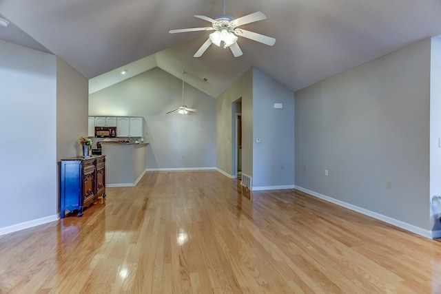 unfurnished living room featuring ceiling fan, high vaulted ceiling, and light hardwood / wood-style floors