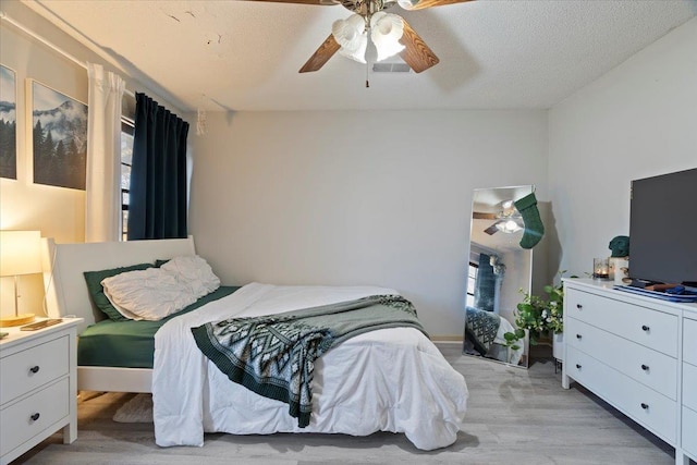 bedroom featuring ceiling fan and light wood-type flooring