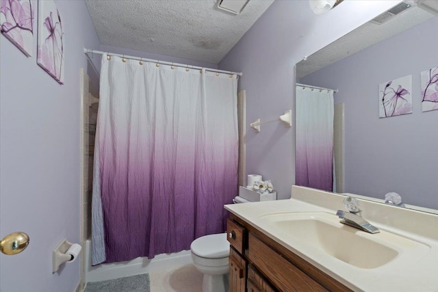 full bathroom featuring vanity, shower / bath combo, toilet, and a textured ceiling