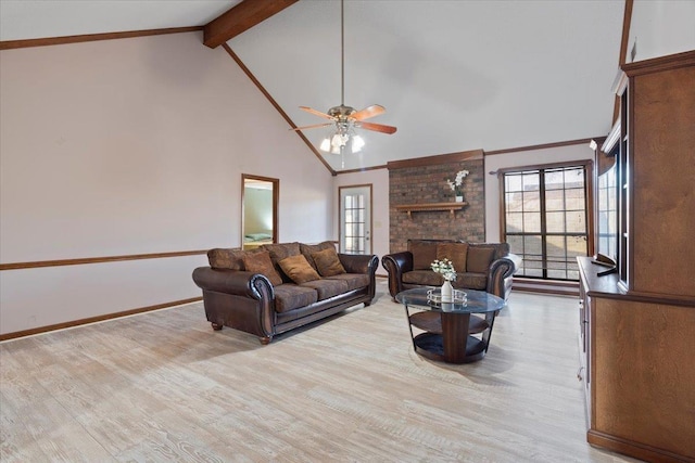 living room with high vaulted ceiling, a fireplace, beamed ceiling, ceiling fan, and light hardwood / wood-style flooring