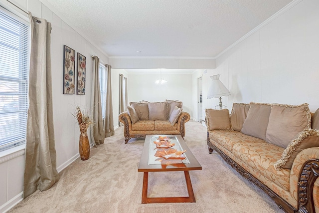 living room with a notable chandelier, crown molding, light colored carpet, and a textured ceiling