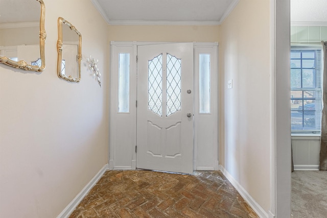 foyer featuring crown molding