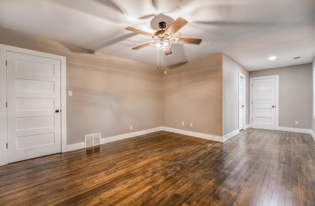 unfurnished room featuring ceiling fan and dark hardwood / wood-style floors