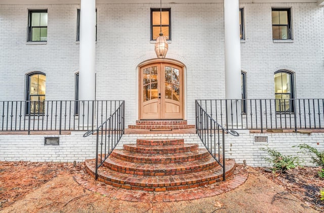 entrance to property featuring french doors