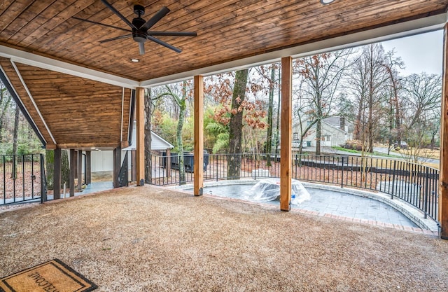 unfurnished sunroom featuring lofted ceiling, wood ceiling, and ceiling fan