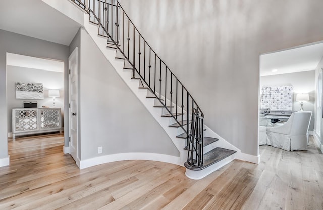 stairway with hardwood / wood-style flooring