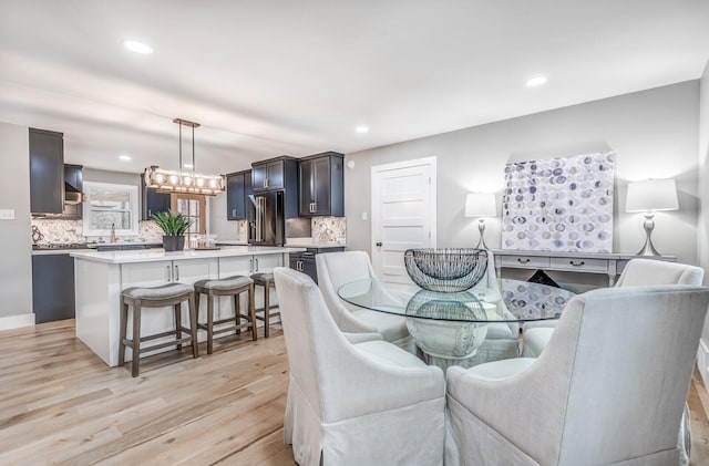 dining space featuring light hardwood / wood-style floors