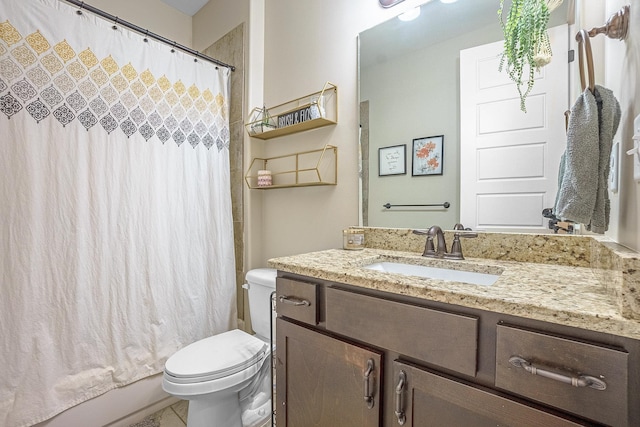 full bathroom featuring vanity, shower / bath combination with curtain, and toilet