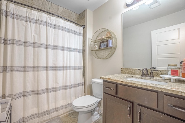 bathroom with vanity, toilet, and a shower with shower curtain