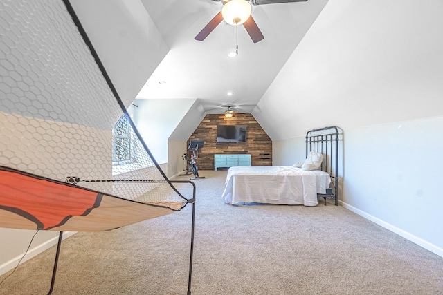 unfurnished bedroom with ceiling fan, vaulted ceiling, and carpet