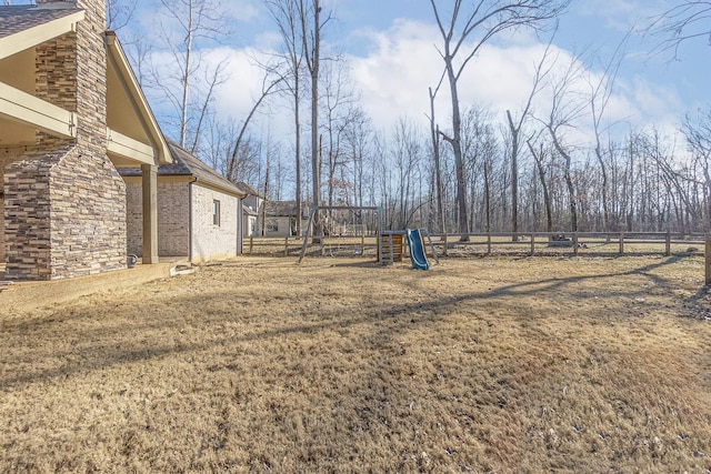 view of yard with a playground