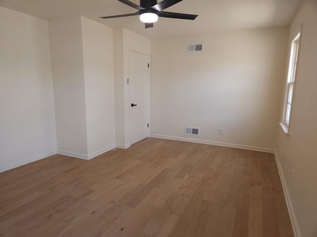 spare room featuring ceiling fan and light hardwood / wood-style flooring