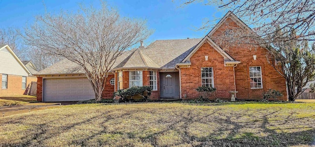 view of front of home featuring a garage and a front yard