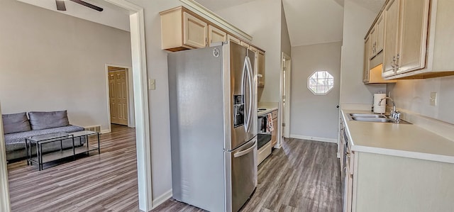 kitchen featuring hardwood / wood-style flooring, sink, light brown cabinetry, and stainless steel fridge with ice dispenser