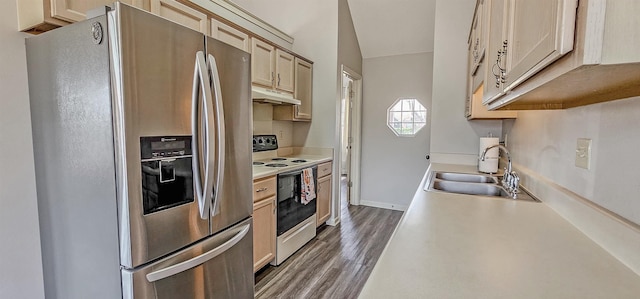 kitchen with dark wood-type flooring, light brown cabinetry, sink, stainless steel fridge, and white range with electric cooktop