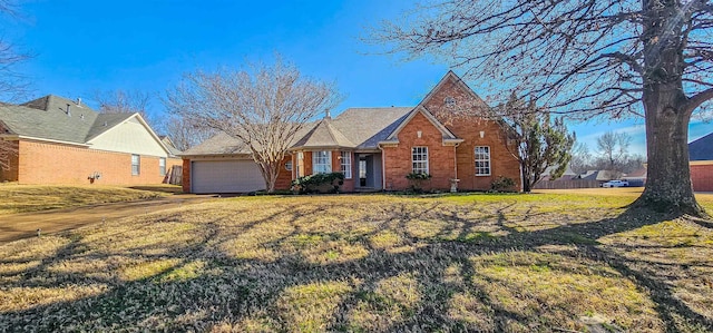 view of front facade with a garage and a front yard