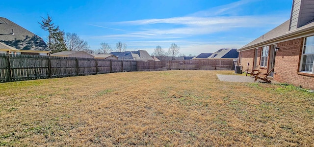 view of yard featuring cooling unit and a patio