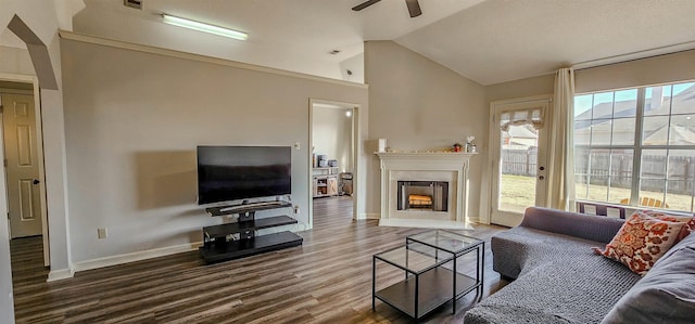 living room with lofted ceiling, wood-type flooring, and ceiling fan