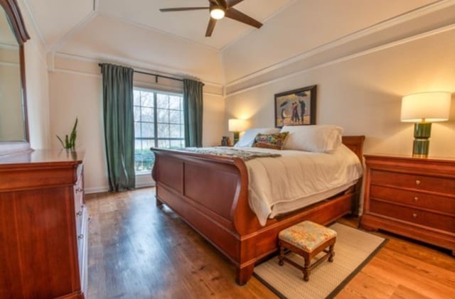 bedroom with hardwood / wood-style floors and ceiling fan