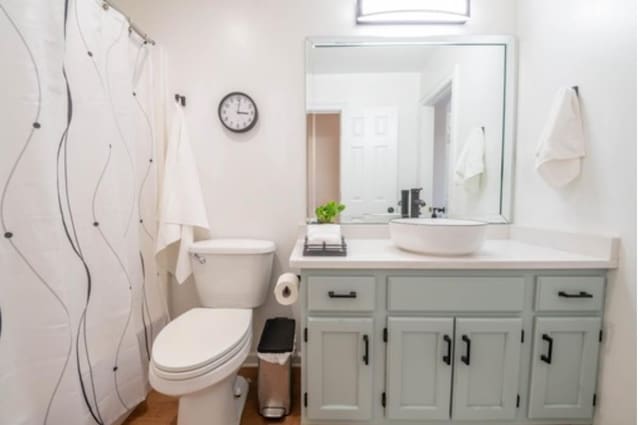 bathroom featuring vanity and toilet