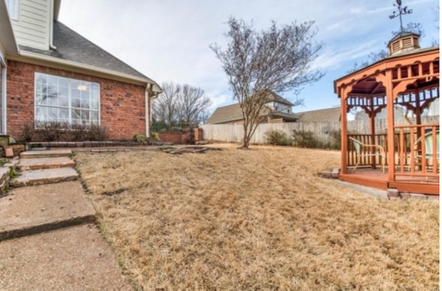 view of yard with a gazebo and a deck