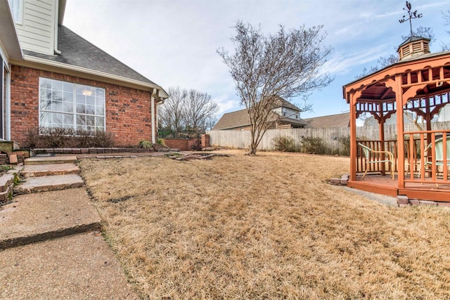 view of yard with a gazebo and a deck