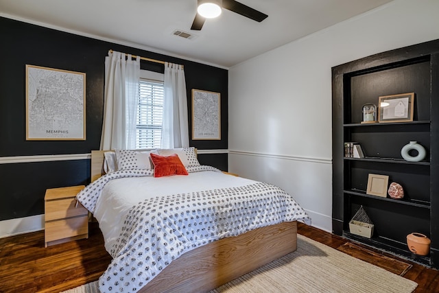 bedroom featuring dark wood-type flooring and ceiling fan