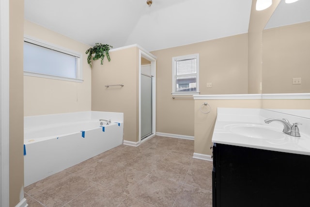 bathroom featuring independent shower and bath, vanity, and tile patterned flooring