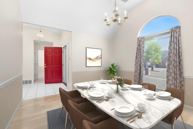 dining area with lofted ceiling, light wood-style flooring, a notable chandelier, visible vents, and baseboards