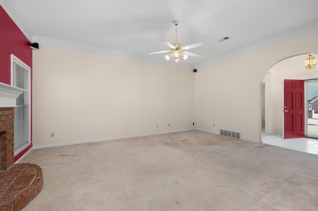 unfurnished living room with ornamental molding, light carpet, and ceiling fan