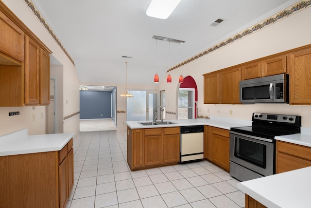 kitchen featuring sink, light tile patterned floors, hanging light fixtures, stainless steel appliances, and kitchen peninsula