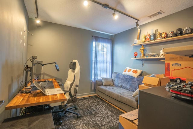 office with a textured ceiling