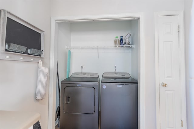 clothes washing area featuring washing machine and clothes dryer