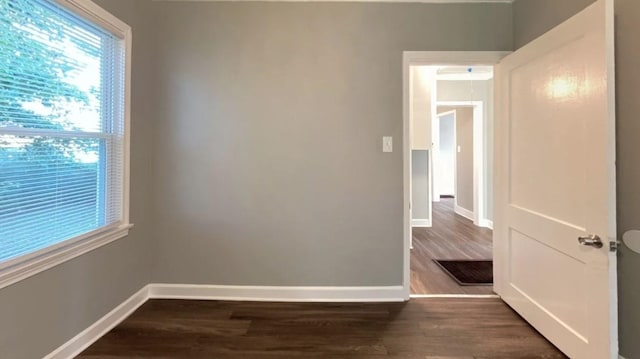 empty room featuring dark hardwood / wood-style floors