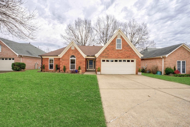 view of front of house with a garage and a front lawn