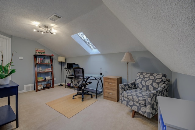 carpeted office with vaulted ceiling with skylight and a textured ceiling