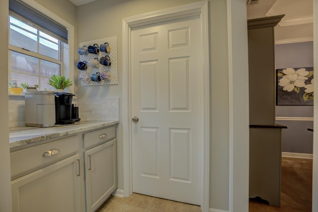 kitchen with light stone counters and light tile patterned floors