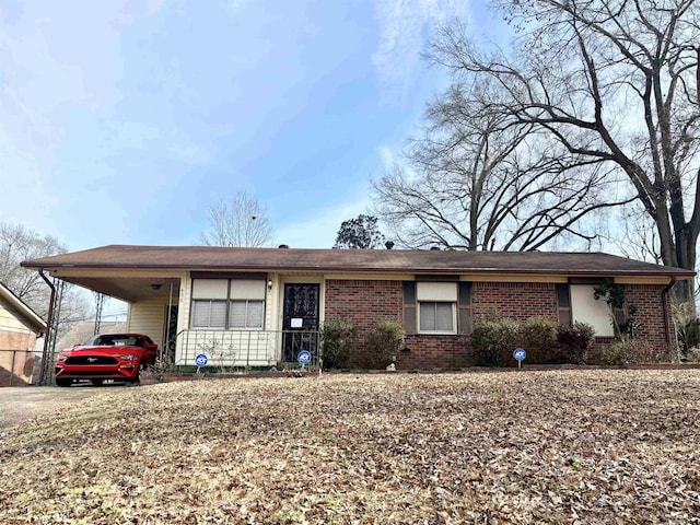 ranch-style house featuring a carport