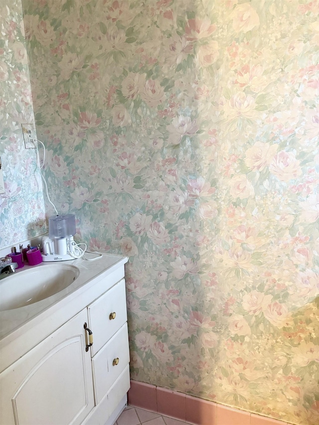 496 Chalmers Rd, Memphis, TN 38120 - bathroom with vanity, baseboards, tile patterned floors, and wallpapered walls
