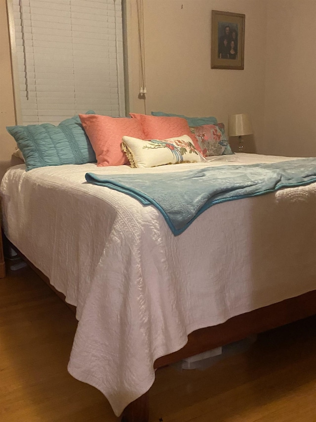 bedroom featuring wood-type flooring