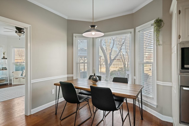 dining room featuring hardwood / wood-style flooring, ceiling fan, and crown molding