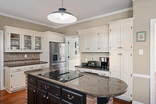 kitchen featuring dark hardwood / wood-style flooring, white cabinetry, stainless steel refrigerator with ice dispenser, a kitchen island, and black electric cooktop