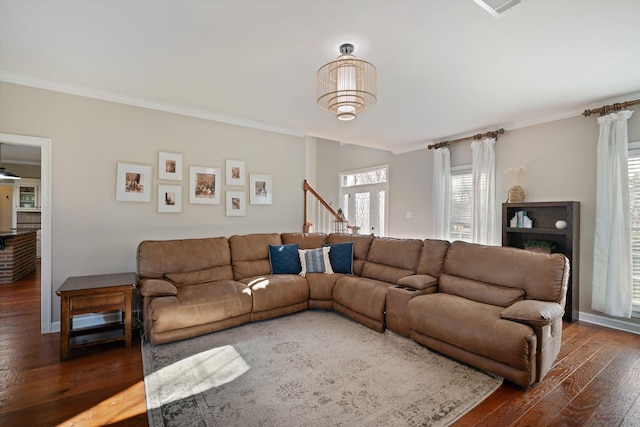 living room with crown molding and dark hardwood / wood-style flooring