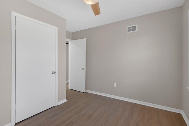 unfurnished bedroom with light hardwood / wood-style floors and ceiling fan