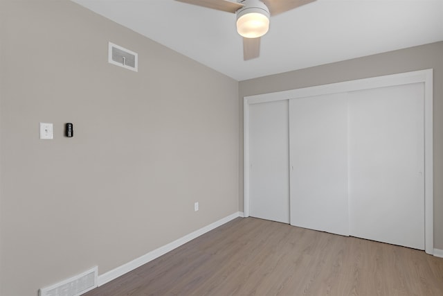 unfurnished bedroom with a closet, ceiling fan, and light hardwood / wood-style flooring